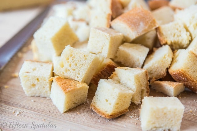 Cubes of Bread on Cutting Board