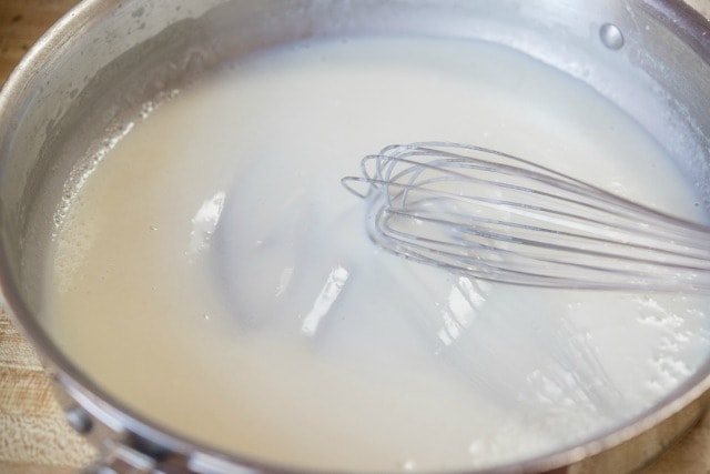 Roux Sauce in Skillet with Whisk for Buffalo Alfredo