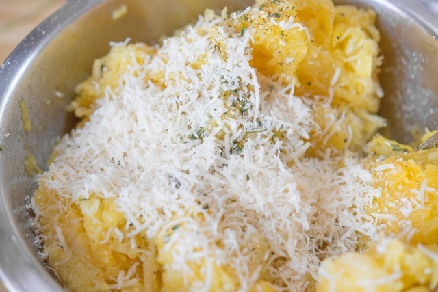 Parmesan Cheese Sprinkled on Spaghetti Squash in Bowl