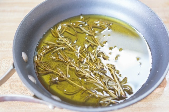 Rosemary Sprigs in Olive Oil in Skillet