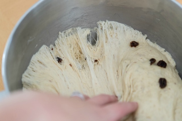 Pulling Back the Stretchy Webby Risen Dough from the Bowl