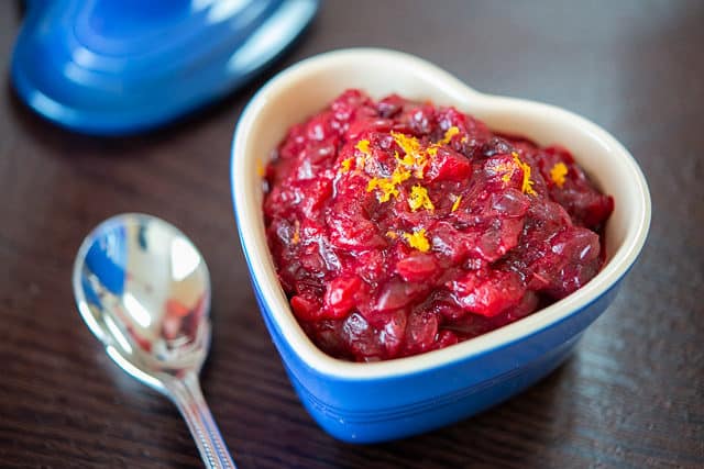 Cranberry Sauce - In a Blue Heart Dish on Wooden Board