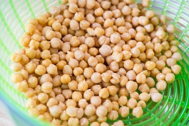 Peeled Chickpeas Drained in Green Colander