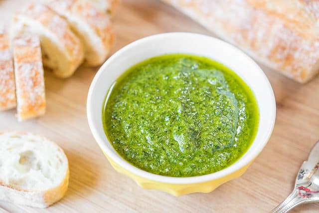 Basil Pesto Recipe - Served in Yellow Bowl with Baguette Slices
