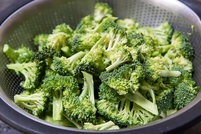Raw Broccoli Florets in Colander