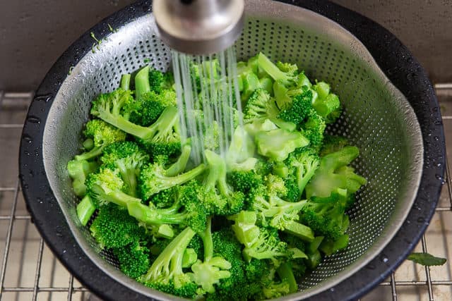 Rinsing Blanched Broccoli Florets in Water