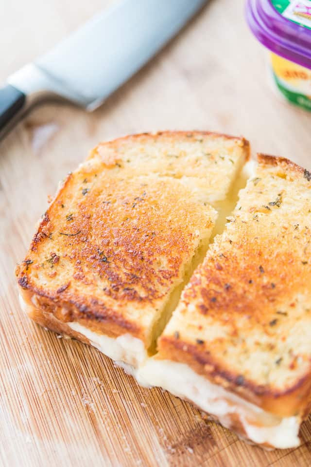 Brie Grilled Cheese - Cut in Half on Cutting Board
