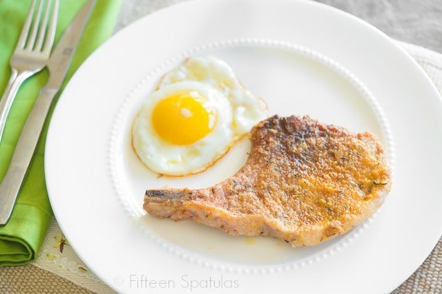 Pan Seared Pork Chop - On a Plate with a Fried Egg