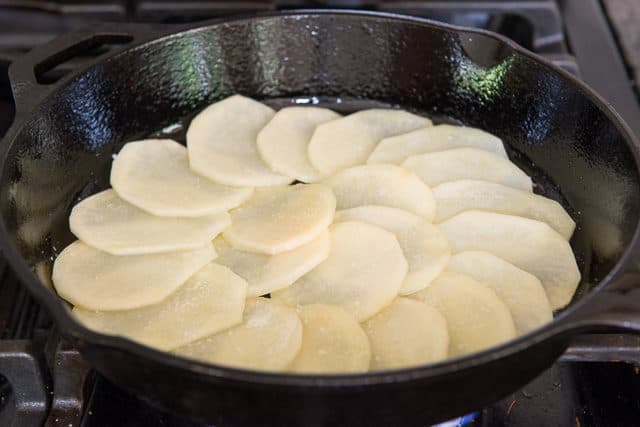 Sliced Potatoes in Cast Iron Skillet