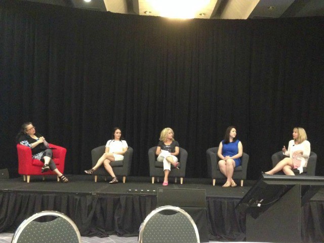Speaking Panel on Stage at Conference