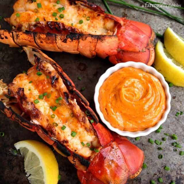 Grilled Lobster Tail Recipe On Platter with Sriracha Butter and Lemon