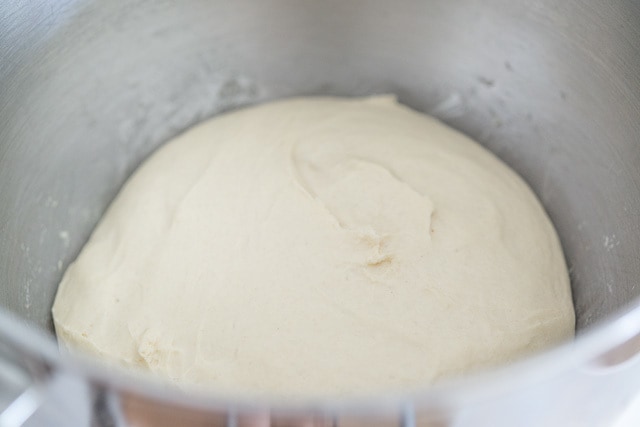Risen Pizza Dough in Stand Mixer Bowl