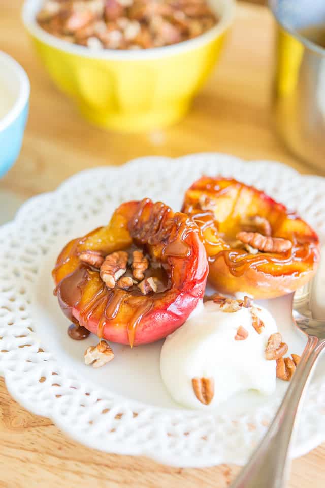 Grilled Peaches with Bourbon Butter Sauce on Plate with Cream