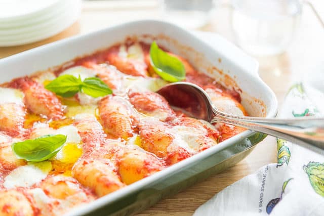 Ricotta Cheese Stuffed Shells - In Casserole Dish with Fresh basil On top