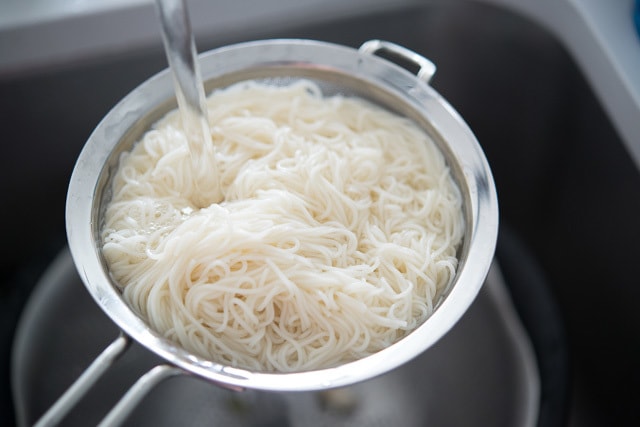 Rinsing Boiled Noodles in Strainer with Cold Water