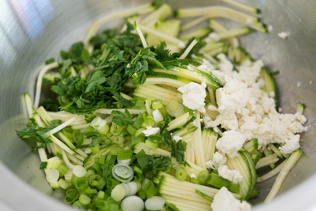 Shredded Zucchini, Scallions, Herbs, and Feta in a Bowl