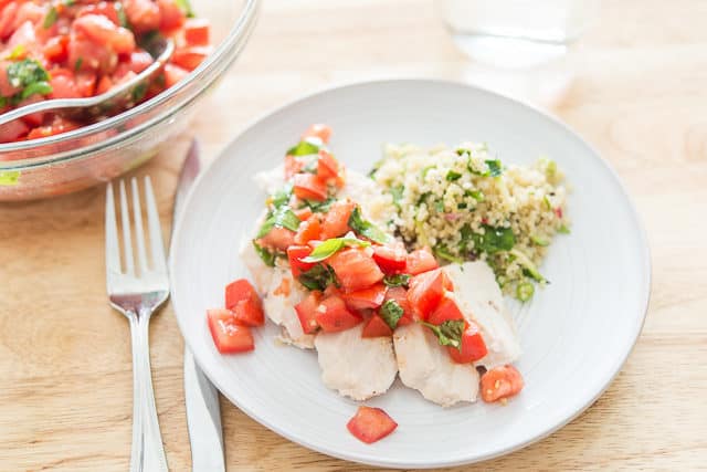 Bruschetta Chicken Recipe Served on a Plate with Couscous Salad