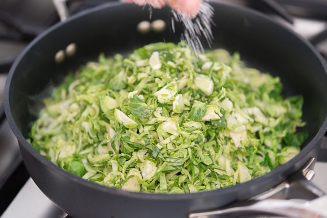 Sauteed Shredded Brussel Sprouts In the Skillet with Salt and Pepper