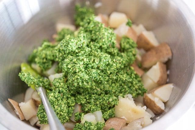 Kale Pesto On Top of Cooked Potato in Bowl