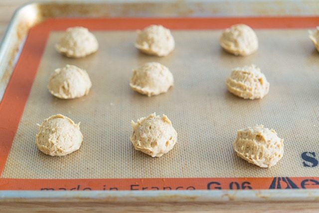 Scoops of Peanut Butter Cookie Dough on Silicone Mat