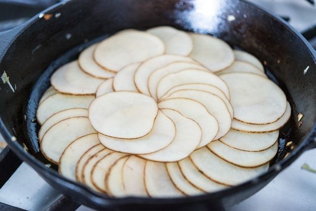 Layered Circles of Potato in Cast Iron