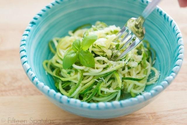 Zoodles Aglio e Olio - In a Blue Bowl with Fork Twirling the Noodles