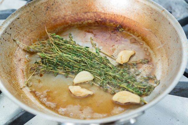 Browned and Reduced Liquid in Skillet with Garlic and Thyme
