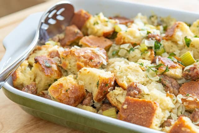 Thanksgiving Stuffing - In Green Casserole Dish with Spoon