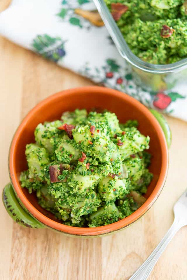 Warm Potato Salad with Kale Pesto and Bacon in Green Bowl