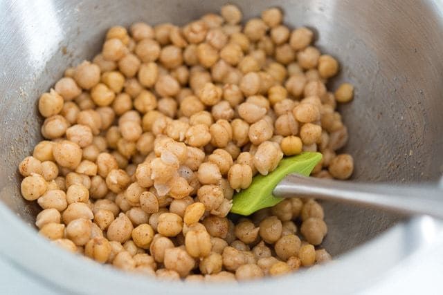 Chickpeas Mixing in a Stainless Steel Bowl