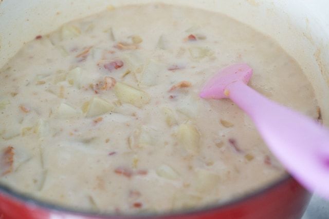 Potato Bacon Soup Simmering in Red Pot