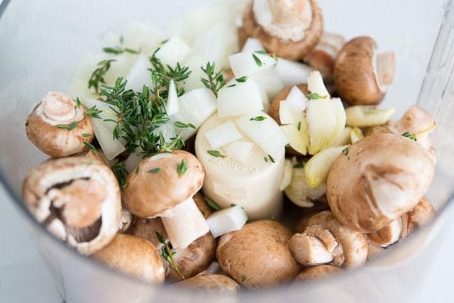 baby Bella Mushrooms, Onion, and Thyme in Food Processor Bowl