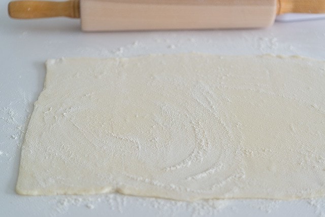 Puff Pastry on a Counter with Flour and Rolling Pin