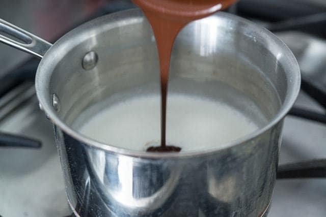 How to Make Homemade Hot Chocolate - By Adding Melted Chocolate to Scalded Milk in Saucepan