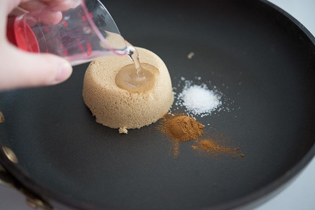 Pouring Water Into Skillet with Brown Sugar, Cinnamon, and Salt