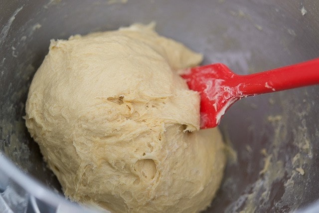 Challah Bread Dough in Mixing Bowl with Red Spatula