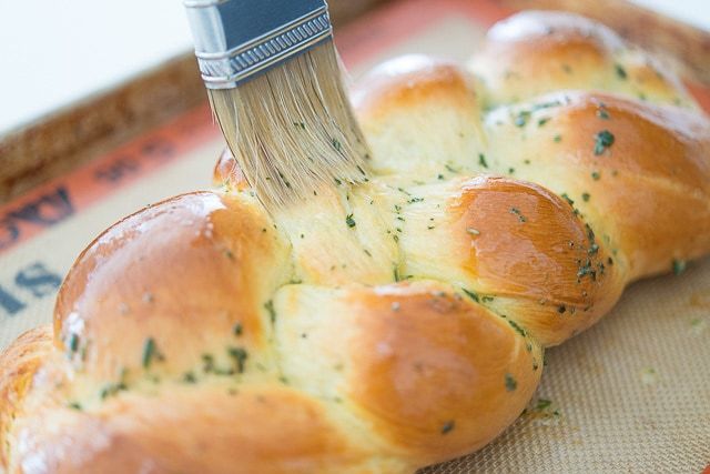Brushing Rosemary Bread Braid with Butter