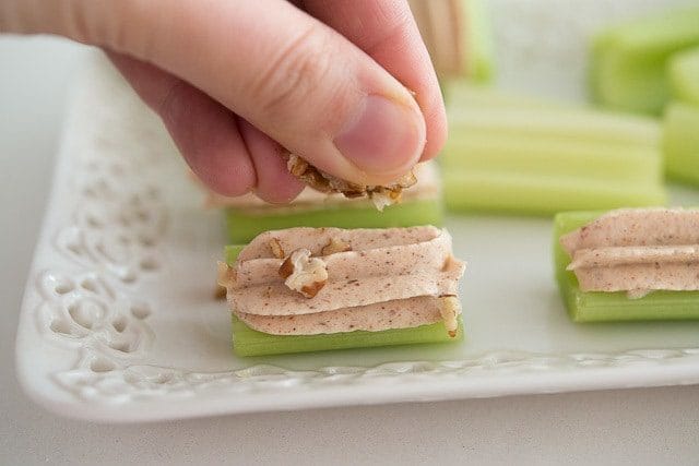 Garnishing Celery Bite with Nuts