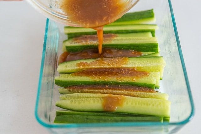 Pouring Miso Dressing on Cucumber Sticks