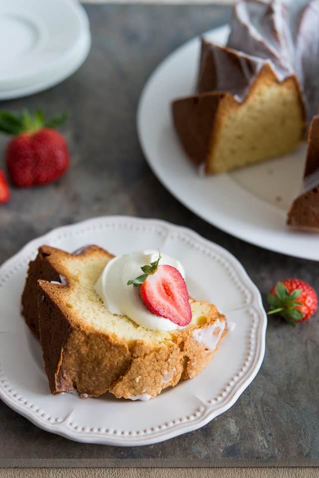 Cream Cheese Pound Cake - Sliced and Plated on White Plates with Cream