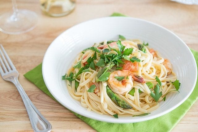 Shrimp Asparagus Pasta - Garnished with Parsley on White Plate