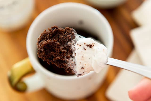 Chocolate Mug Cake Recipe - Served in White Mug with Spoonful Paired with vanilla Ice Cream