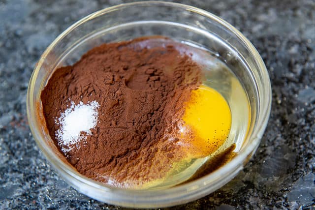 Cocoa Powder, Egg, and Salt in Glass Bowl