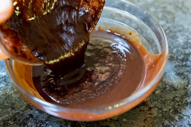 Melted Chocolate Poured in Glass Bowl with Cocoa Egg Mixture