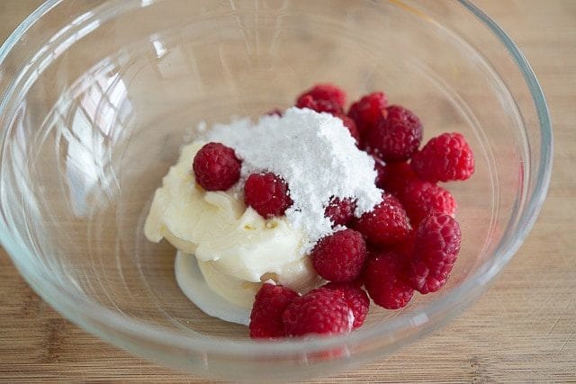 Butter, Raspberries, and Confectioner\'s Sugar in Glass Bowl