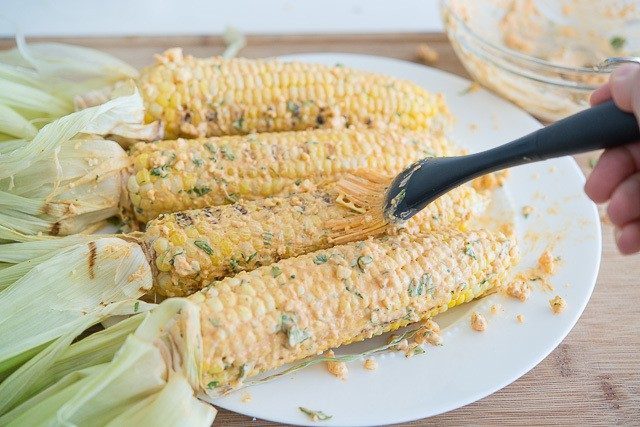 Brushing Corn Cobs with Spicy Butter