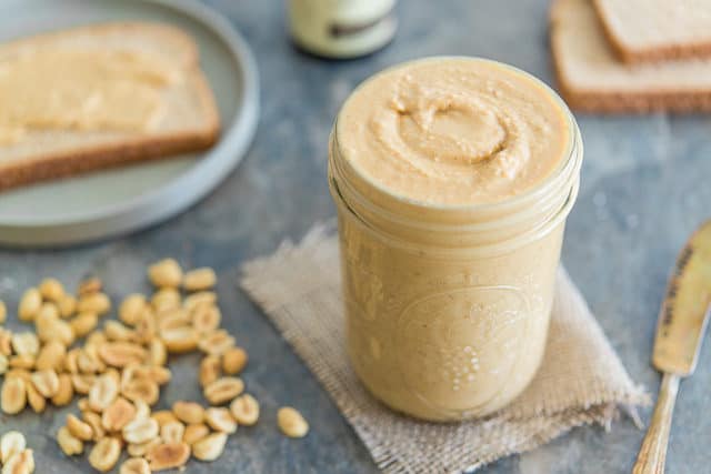White Chocolate Peanut Butter - In a Glass Jar with Bread in Background
