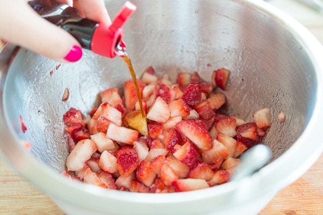 Adding Vanilla Extract to Chopped Strawberries