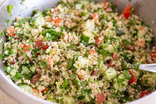 Tabbouleh Salad - In Mixing Bowl with Tomatoes and Cucumbers