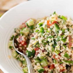 Tabbouleh in a White Bowl with Spoon